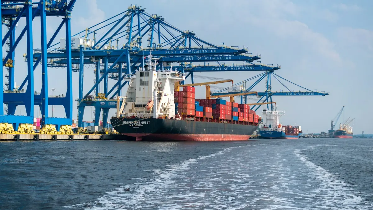 A ship leaving a container terminal