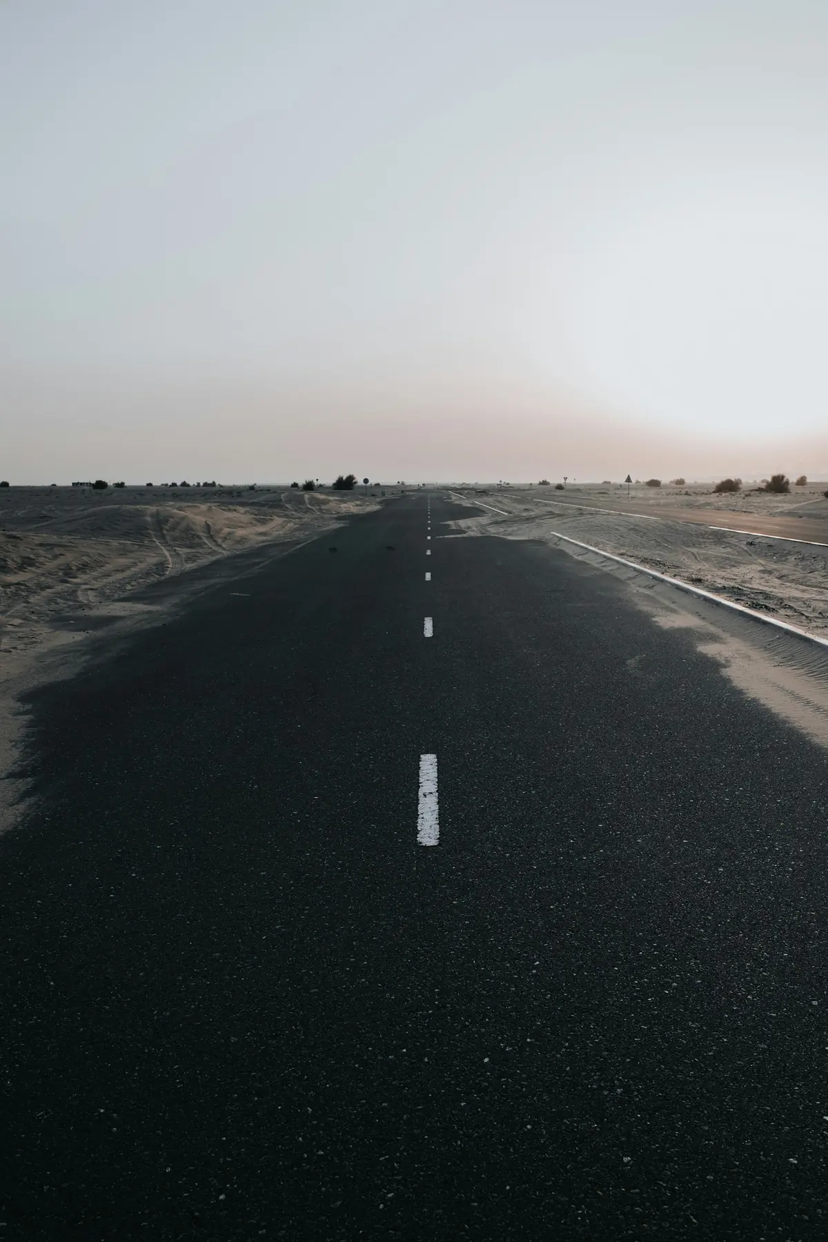 Straight asphalt road to the horizon