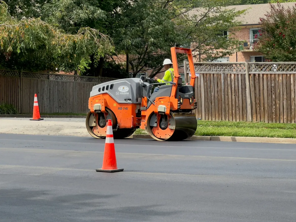 Roller finishing a fresh asphalt surface