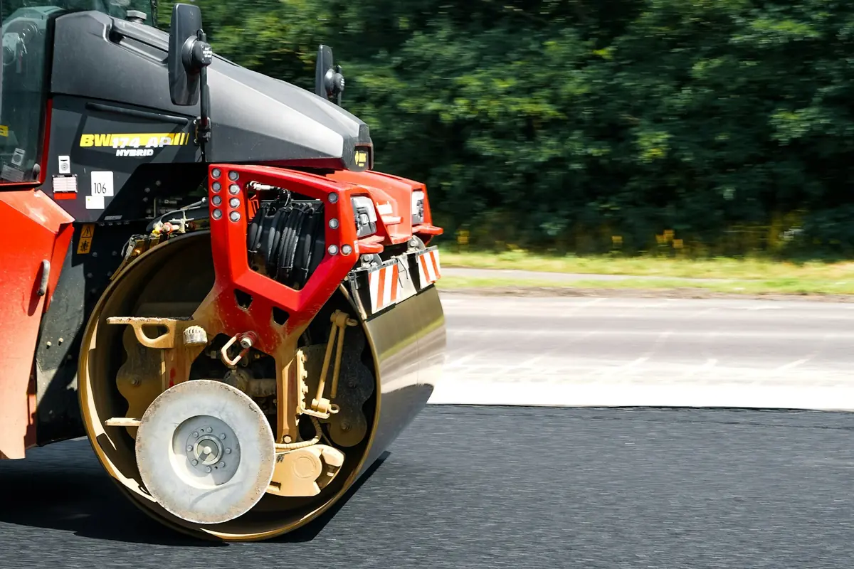Road roller on freshly paved asphalt